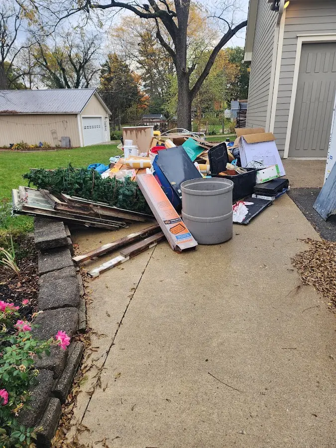 Dumpster being loaded with debris for 30 Yard Dumpster Rental in Ranlo
